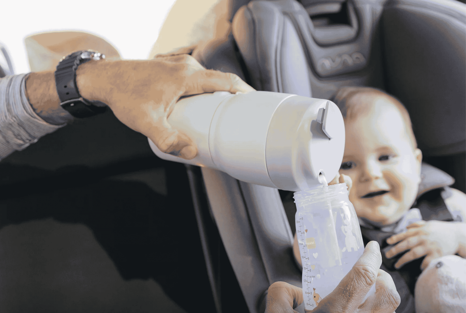 A person is feeding a baby with a papablic product